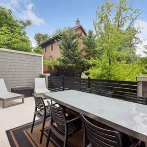 Deck with outdoor table and lounge chairs