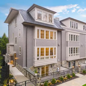 Exterior view of new construction homes in Chestnut Hill with garage and driveway