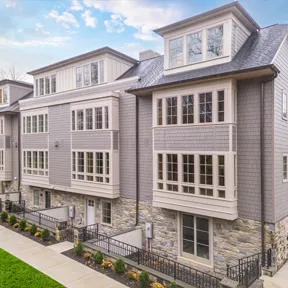 Exterior of new construction homes in Chestnut Hill, PA with driveways and garages