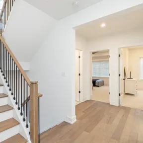 Second floor hallway showing staircase and leading to bedrooms in Chestnut Hill, PA home