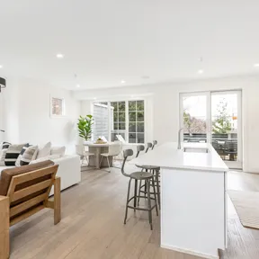 Kitchen and family room with view out to the attached deck