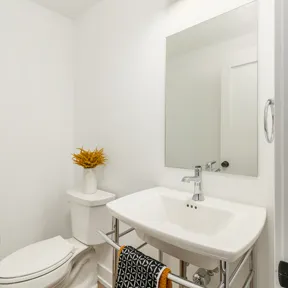 Powder room of the home with toilet and vanity