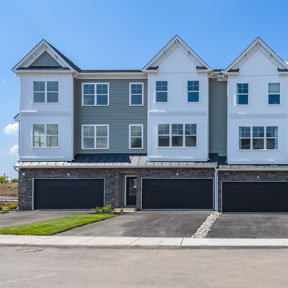 Exterior view of new construction homes in Bucks County with garage and driveway