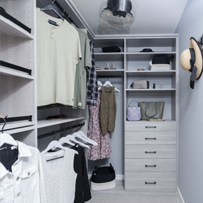 New construction walk in closet in the Hamilton model featuring built in shelving, drawers, and storage.