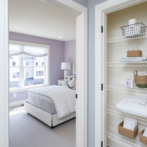 Linen closet with extra storage in the hallway of the Hamilton model at The Reserve at Chalfont