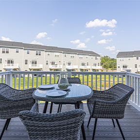 Reserve at Chalfont outdoor deck of the Jordan model home with sliding glass door and seating