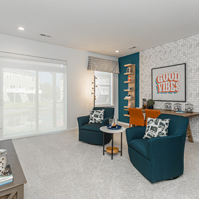 The Jordan flex  room at Reserve at Chalfont with carpeting and desk set up for work or school