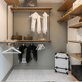 Owner's suite walk in closet with wood style shelving at the new construction homes in Bucks County PA