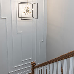 Stairwell at The Reserves at Spring Mill luxury new homes featuring wall picture frame molding