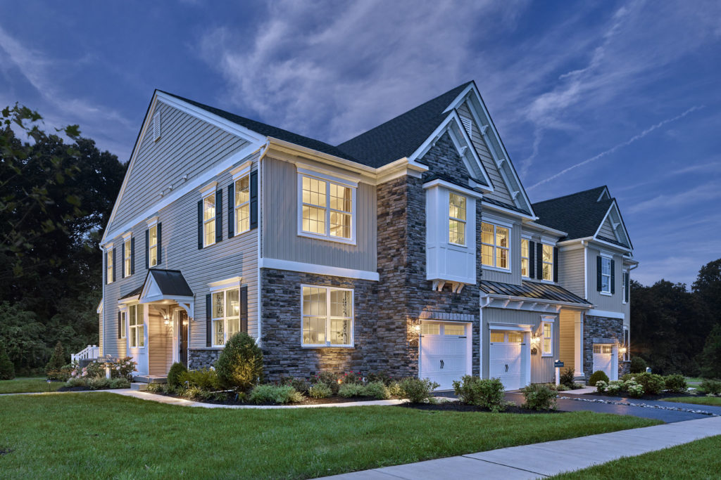 Photo of Exterior Townhome at The Reserve at Glen Loch at twilight.
