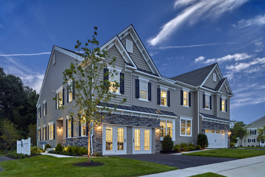 Exterior photo of carriage homes at The Reserve at Glen Loch at twilight.