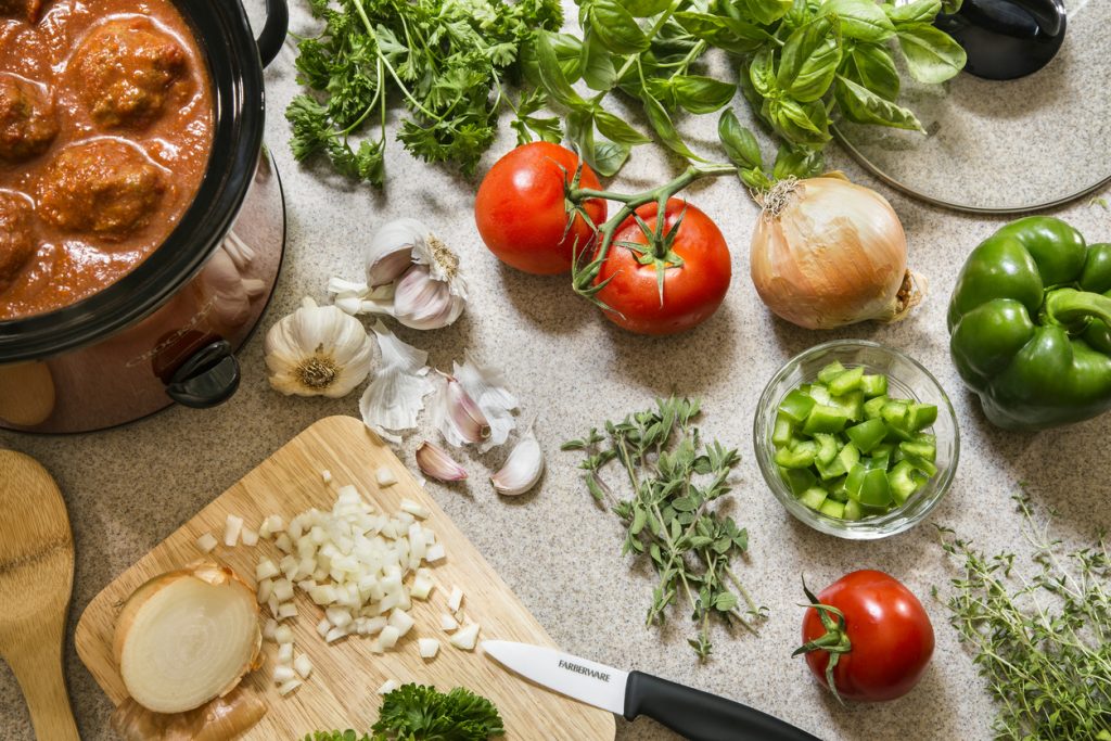 vegetables and cutting board on counter