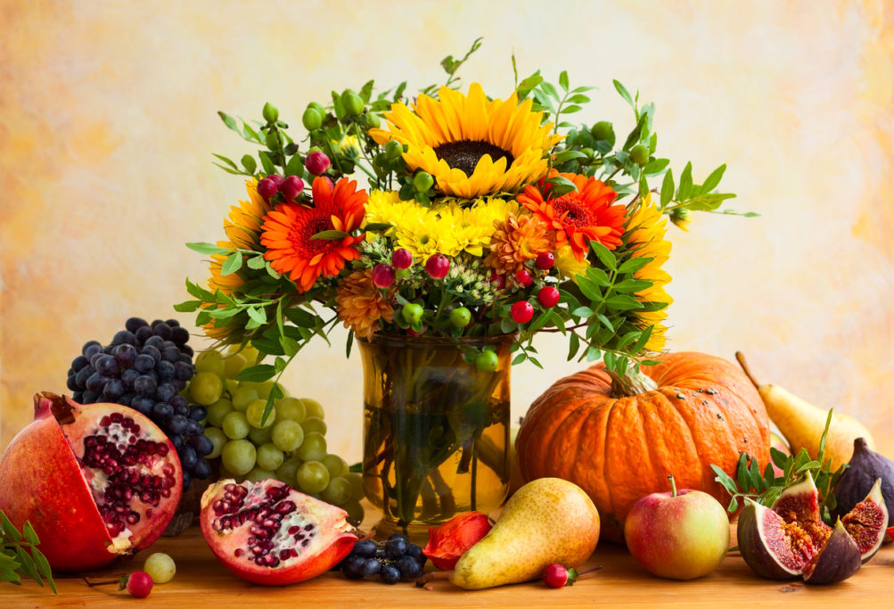 Autumn still life with flowers, pumpkin and fruits