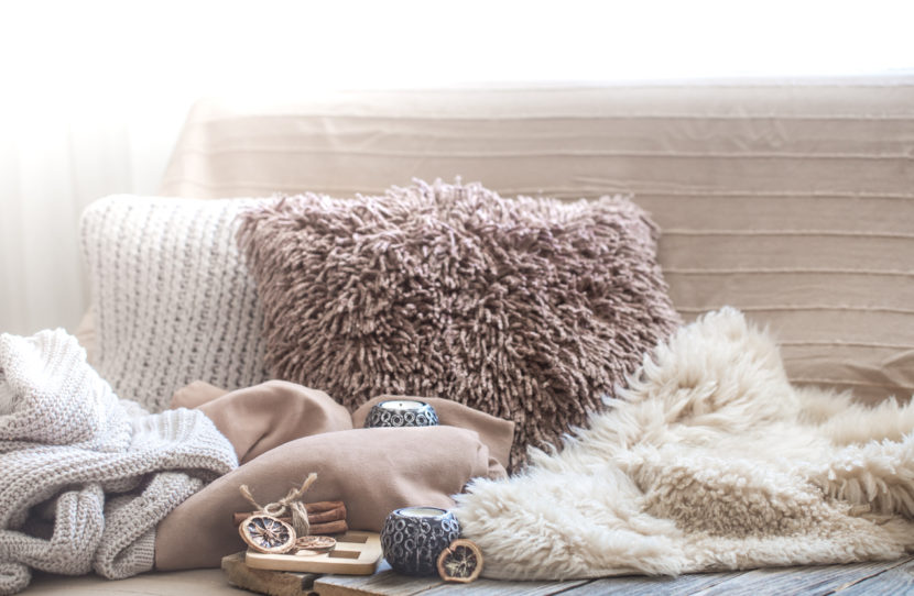 Hygge decor, cozy pillows and blankets