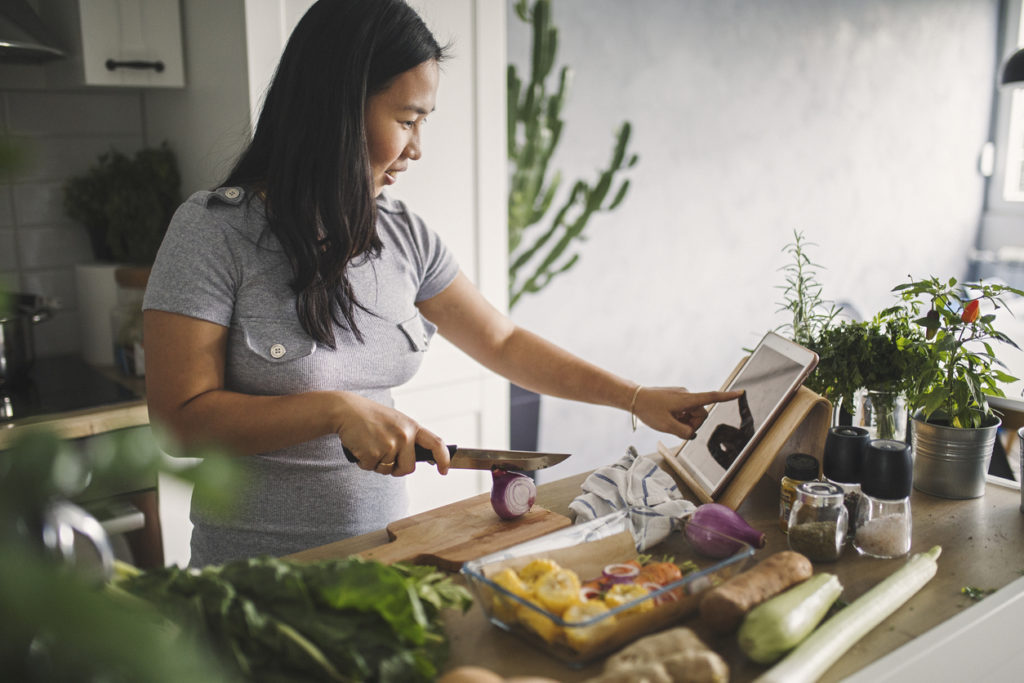 Woman at home making healthy meal