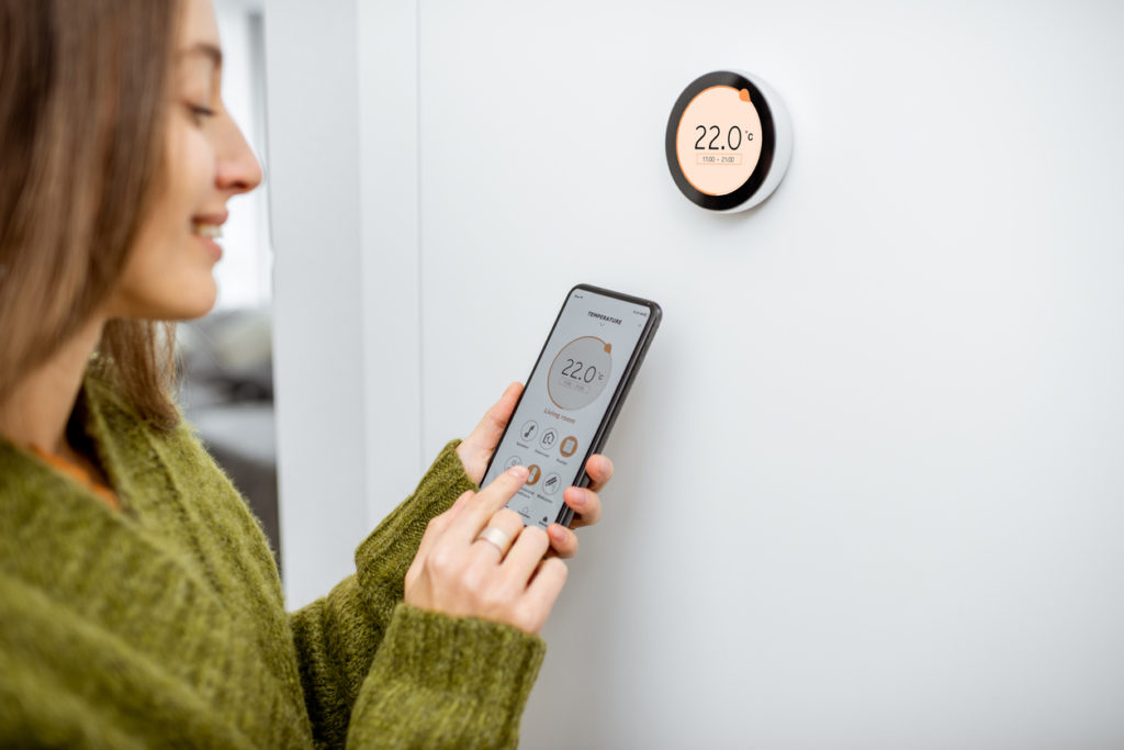 Woman using smart home technology